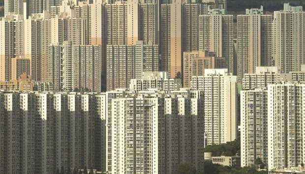 Public and private housing blocks are seen in Hong Kong. Hong Kongu2019s private home prices fell for the fifth consecutive month in  December, down 2.4% from November, official data showed. But prices still climbed 1.6% for the whole of 2018.