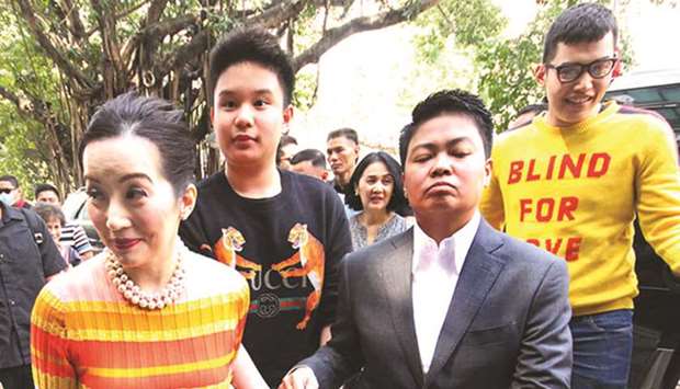 Television host and actress Kris Aquino walks with her lawyer and sons, Bimby and Josh to the Quezon City Prosecutoru2019s Office.