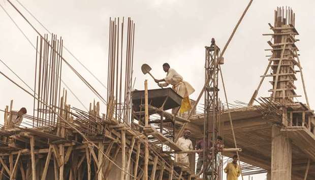 Workers at a construction site in Karachi. The Planning Commission of Pakistan in its envisaged macroeconomic framework has set an average GDP growth target of 5.4%, jacking up allocation of development outlay to Rs11.7tn.