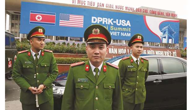 Vietnamese police officers stand guard outside the North Korea-USA summitu2019s media centre in Hanoi yesterday.