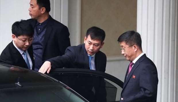 Kim Hyok Chol, (R), North Korea's special representative for US, affairs leaves the Government Guesthouse in Hanoi, Vietnam