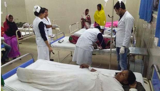 Indian victims are under medical treatment at Jorhat hospital after allegedly drinking toxic bootleg liquor in Assam's Golaghat district . AFP