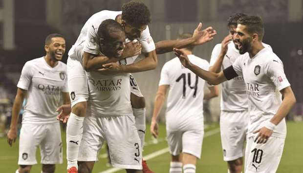 Al Saddu2019s Abdelkarim Hassan celebrates with teammates after scoring against Al Rayyan in the QNB Stars League yesterday. PICTURE: Noushad Thekkayil