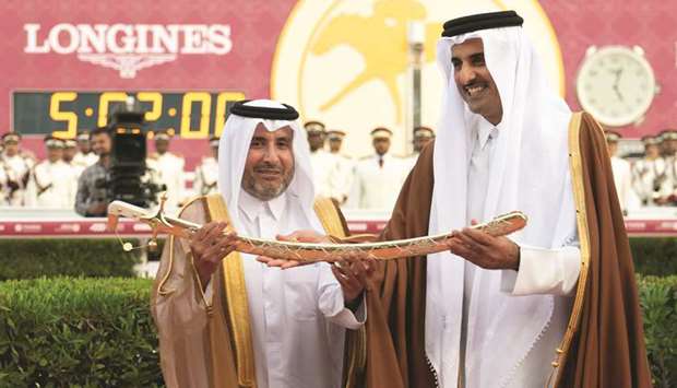 His Highness the Amir Sheikh Tamim bin Hamad al-Thani presents the sword to His Highness Sheikh Mohamed bin Khalifa al-Thani after Ebraz won HH The Amir Sword (Group 1 PA).