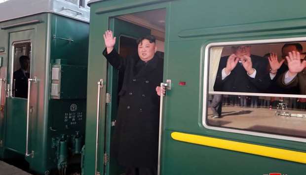 North Korean leader Kim Jong Un waves from a train as he departs for a summit in Hanoi, in Pyongyang, North Korea in this photo released by North Korea's Korean Central News Agency (KCNA) on February 23, 2019. KCNA via REUTERS