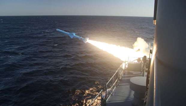A handout photo made available by the Iranian Navy office yesterday, shows an Iranian Navy missile launch during a military drill in the Gulf of Oman