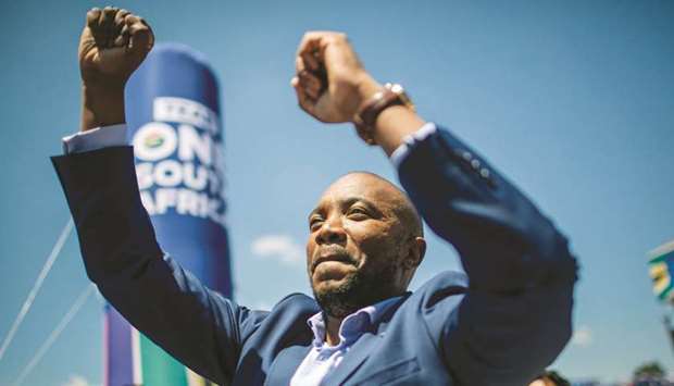 South African opposition political party Democratic Alliance leader Mmusi Maimane waves to the crowd after delivering his speech at The Rand Stadium in Johannesburg yesterday.