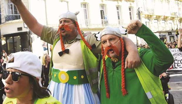 Protesters dressed as Obelix and Asterix take part in a u2018yellow vestu2019 demonstration in Montpellier, southern France.