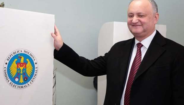 Moldovan President Igor Dodon visits a polling station during a parliamentary election in Chisinau.