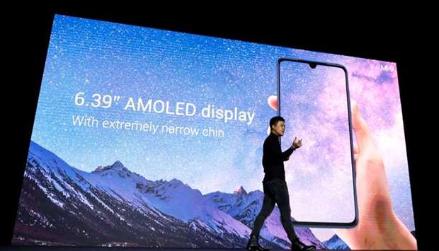 Xiaomi's Director of Product Management Donovan Sung presents the new Xiaomi Mi 9 mobile phone ahead of the Mobile World Congress (MWC 19) in Barcelona, Spain