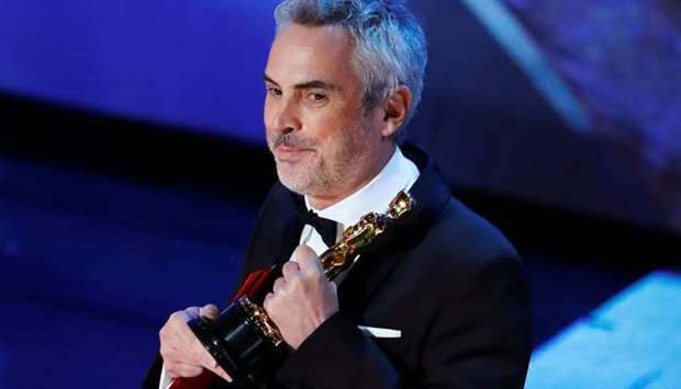 Alfonso Cuaron accepts the Foreign Language Film award for ,Roma,. REUTERS