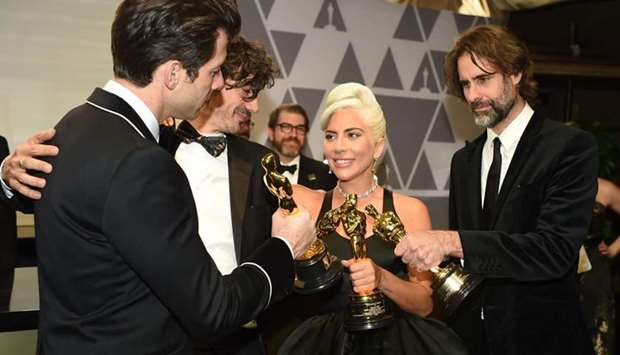 Best Original Song nominees for ,Shallow, from ,A Star is Born, Lady Gaga (C), Mark Ronson (L), Anthony Rossomando and Andrew Wyatt (R) attends the 91st Annual Academy Awards Governors Ball at the Hollywood & Highland Center in Hollywood, California
