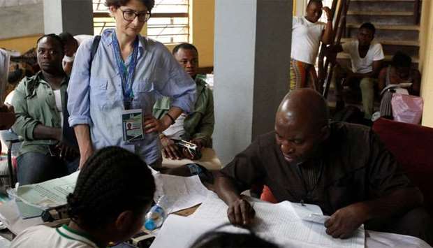 A foreign election observer monitors a collation center, as Nigerians await the results of the Presidential election, in Abuja, Nigeria