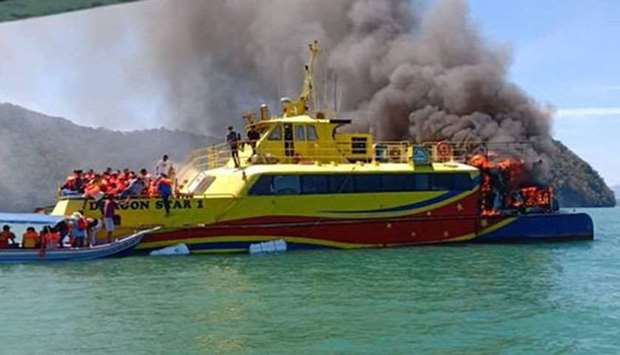 Malaysian passenger ferry with 58 people onboard caught fire