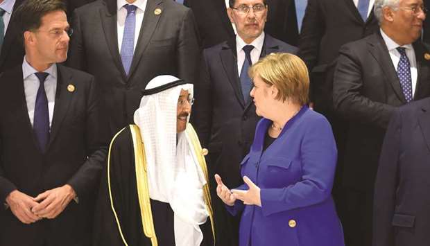 Germanyu2019s Chancellor Angela Merkel talks with Amir of Kuwait Sheikh Sabah al-Ahmad al-Sabah during the first joint European Union and Arab League summit in Sharm el-Sheikh, yesterday.