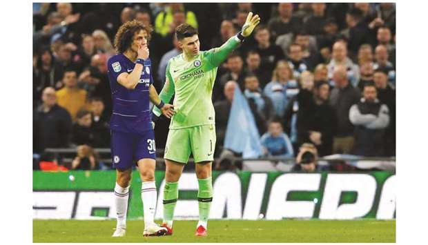 Chelseau2019s goalkeeper Kepa Arrizabalaga (right) gestures after he is called to be substituted off as defender David Luiz talks to him during the League Cup final against Manchester City at Wembley Stadium in London on Sunday. (Reuters)