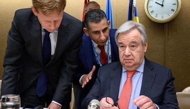 UN Secretary-General Antonio Guterres (R) looks on at the opening of a pledging conference for the humanitarian crisis in Yemen at the United Nations offices in Geneva