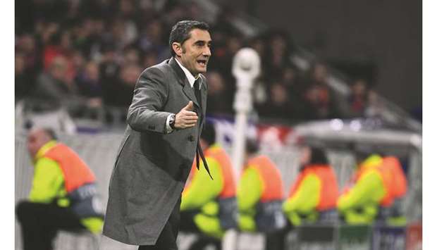 Barcelonau2019s Spanish coach Ernesto Valverde gestures during the UEFA Champions League round of 16 first leg football match between Lyon (OL) and FC Barcelona at the Groupama Stadium in Decines-Charpieu, central-eastern France, on February 19. (AFP)