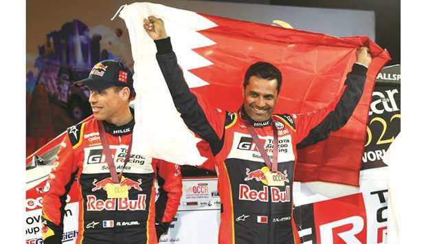 Qataru2019s Nasser Saleh al-Attiyah (right) and his co-driver Matthieu Baumel (left) celebrate their Manateq Qatar Cross-Country Rally yesterday. PICTURE: Anas Khalid