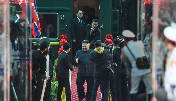 North Korean leader Kim Jong Un (C) arrives at the Dong Dang railway station in Dong Dang, Lang Son province