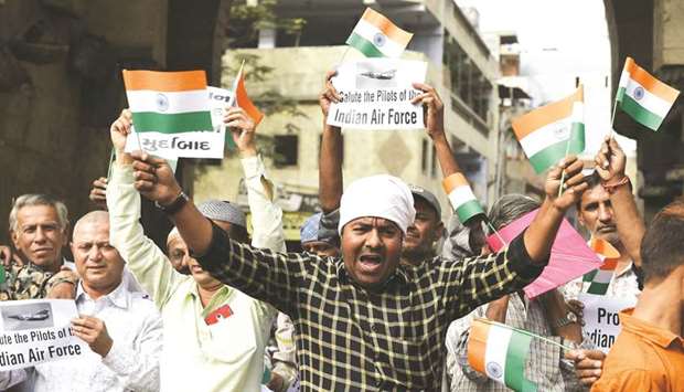 Protesters shout slogans as they celebrate the Indian Air Force (IAF) strike on a Jaish-e-Mohamed (JeM) camp in Balakot, in Ahmedabad yesterday.