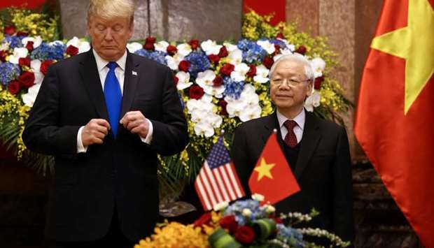 Vietnamese President Nguyen Phu Trong and US President Donald Trump attend a signing ceremony at the Presidential Palace in Hanoi, Vietnam,