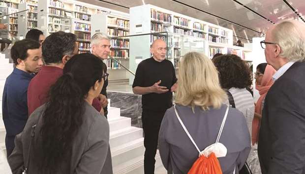 Qatar National Library designer and renowned Dutch architect Rem Koolhaas speaks to a team of Culture Pass members during a tour.
