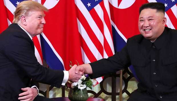U.S. President Donald Trump and North Korean leader Kim Jong Un shake hands before their one-on-one chat during the second US-North Korea summit at the Metropole Hotel in Hanoi, Vietnam