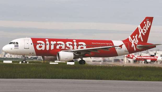 An AirAsia Airbus A320-200 plane prepares for take off at Don Mueang International Airport in Bangkok. The airline posted a bigger than expected loss of 395mn ringgit ($97mn) in the fourth quarter, versus a 372.6mn ringgit profit a year earlier.