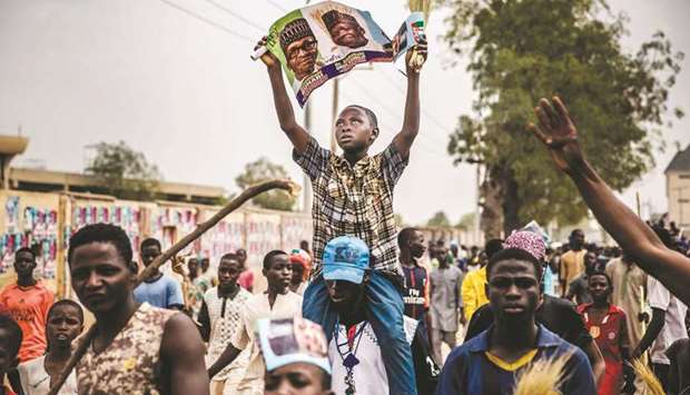 All Progressives Congress supporters rally as they celebrate the re-election of the incumbent President Muhammadu Buhari in Kano yesterday.