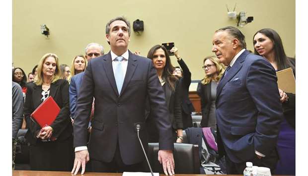 Michael Cohen prepares to testify yesterday before the House Oversight and Reform Committee in the Rayburn House Office Building on Capitol Hill in Washington, DC.