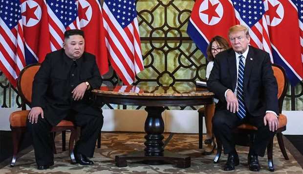US President Donald Trump (R) and North Korea's leader Kim Jong Un hold a meeting during the second US-North Korea summit at the Sofitel Legend Metropole hotel in Hanoi