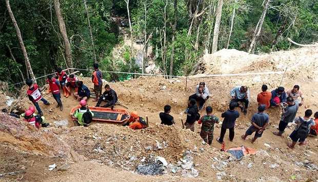 Rescuers preparing to enter in a collapsed illegal gold mine in the Bolaang Mongondow region of Nort