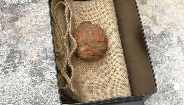 Hong Kong Police Force shows World War I-era German hand grenade that was found among a shipment of French potatoes bound for a potato chips factory