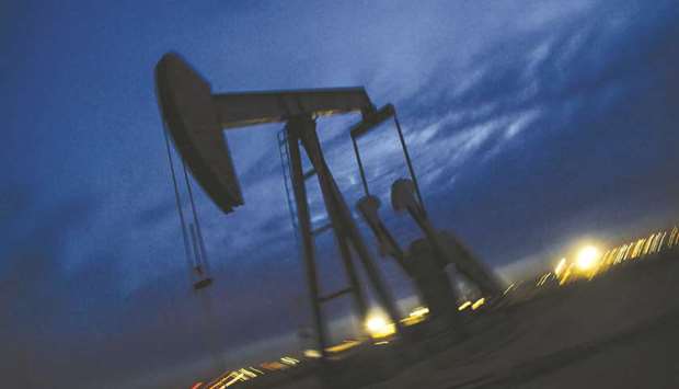 A pump jack stands at dusk in the Permian Basin area of Loving County, Texas (file). Exxon Mobil and Chevron are investing heavily in Texas pipelines and  processing facilities as they build out their rig-to-refinery approach to the Permian Basin, demonstrating how shale is becoming a core driver of the worldu2019s biggest oil companiesu2019 future growth.