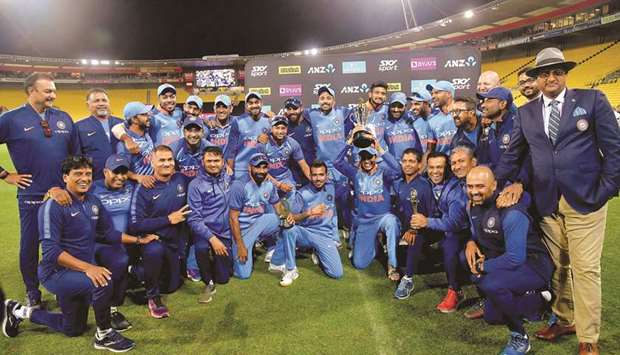 India players celebrate after winning the fifth one-day international match against New Zealand in Wellington yesterday. (AFP)