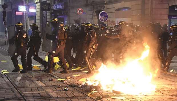 Riot police officers disperse demonstrators during an anti-government demonstration called by the Yellow Vests movement in Bordeaux. As the Yellow Vest protests in France demonstrate, people will not support making the world greener if it makes their daily lives harder.