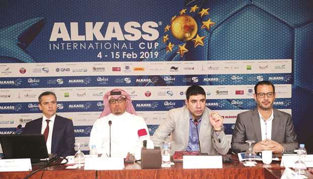 Organising Committee member Ward Abdullah (third from left) speaks to the media yesterday in the presence of other officials. At bottom, an official displays the Aspire Academy jersey.