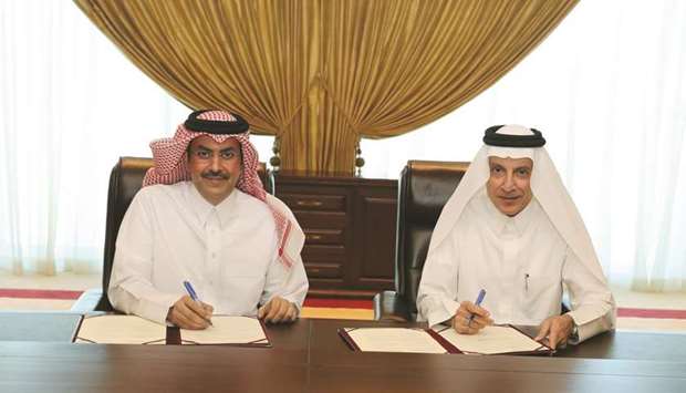 Abdulla bin Nasser Turki al-Subaey and HE Akbar al-Baker at the signing ceremony.