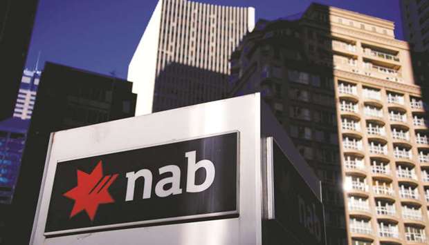 The logo of the National Australia Bank is displayed outside its headquarters building in Sydney. A special government-appointed inquiry excoriated Australiau2019s financial sector for misconduct yesterday, referring two dozen cases to regulators for possible legal action but leaving the structure of the countryu2019s powerful banks in place.