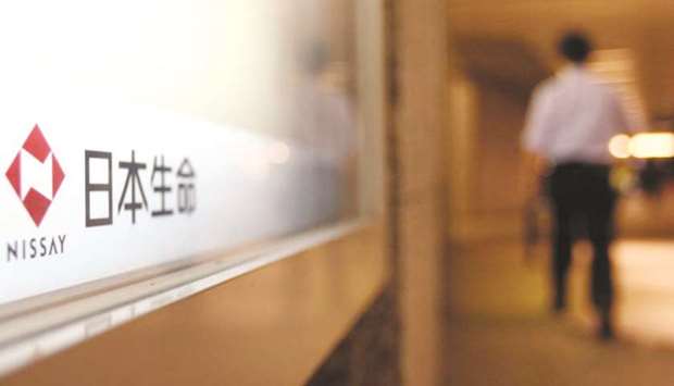 A man walks near the logo for Nippon Life Insurance in Tokyo. Japanese insurance companies have spent more than $50bn on acquisitions over the past five years to become the worldu2019s second-largest buyer of insurance assets, and the deals spree wonu2019t be slowing down any time soon.