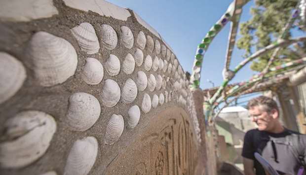 AT WORK: Dr Bruno Pernet, Invertebrate Biology professor at Cal State University Long Beach, eyes shells on the Watts Towers to mull about marine life in the area, especially with respect to invasive species at the Watts Towers.
