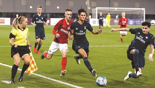 Real Madrid and Spartak Moscow players vie for the ball during the under-17 Alkass International Cup at Aspire academy yesterday. PICTURE: Jayaram Korambil