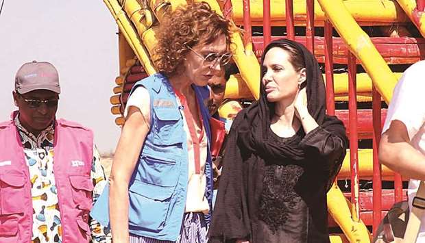 US actress, filmmaker and humanitarian Angelina Jolie (right), a special envoy for the United Nations High Commissioner for Refugees (UNHCR), visits a school in the Kutupalong camp for Rohingya refugees in Ukhia in southern Bangladesh yesterday.