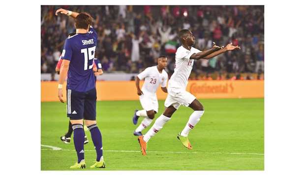 Qataru2019s forward Almoez Ali (right) celebrates after scoring a goal during the AFC Asian Cup final against Japan in Abu Dhabi on Friday. (AFP)