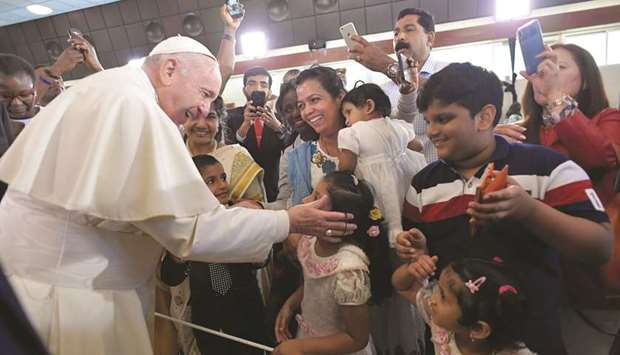 Pope Francis greets people during a visit to the St Josephu2019s Cathedral in Abu Dhabi, yesterday.