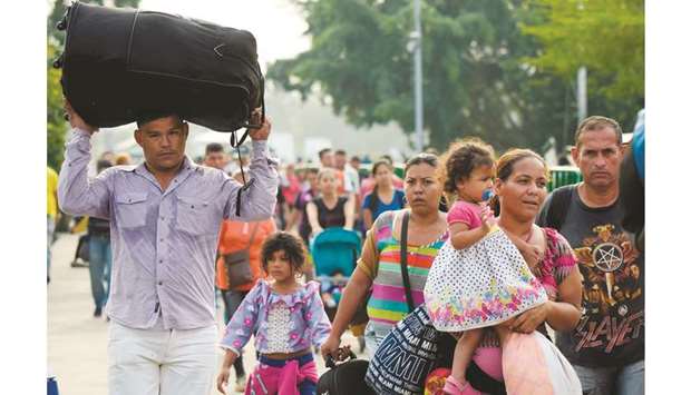 People cross the Simon Bolivar International Bridge on the border between the Colombian city of Cucuta and the Venezuelan town of Tachira.