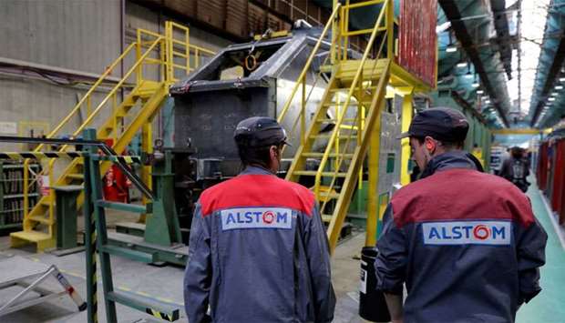 Employees work at the Alstom high-speed train TGV factory in Belfort, France