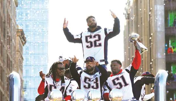 The New England Patriotsu2019 Dontu2019a Hightower (left), Kyle Van Noy (centre), Jau2019Whaun Bentley (right) and Elandon Roberts (standing) ride on flatbed truck during their victory parade after winning Super Bowl LIII, in Boston, Massachusetts, US. (Reuters)