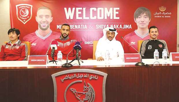 QNB Stars League champions Al Duhailu2019s new signings Medhi Benatia (centre) and Japanese forward Shoya Nakajima (left) with clubu2019s vice president Khalifa Khamis at their unveiling on Tuesday.